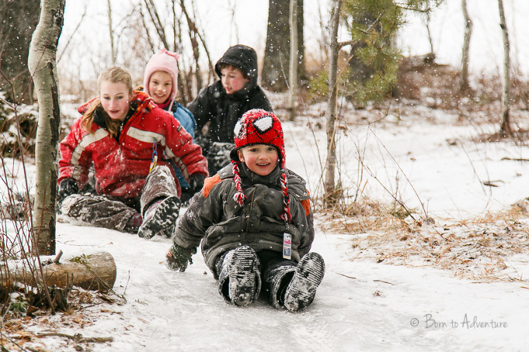 Family sliding on Snow