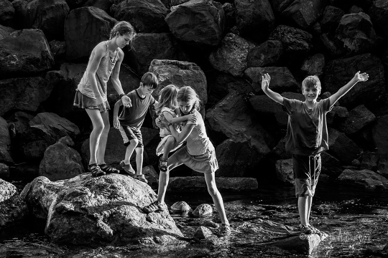 kids playing in the creek