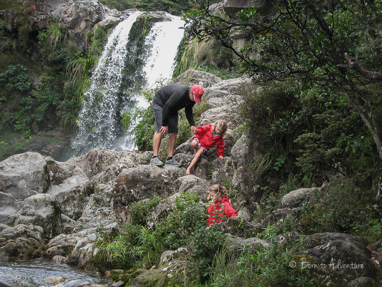 Kids scrambling around Tawhai Falls