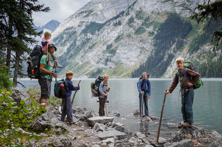 Family of hikers beside Upper Elk Lake
