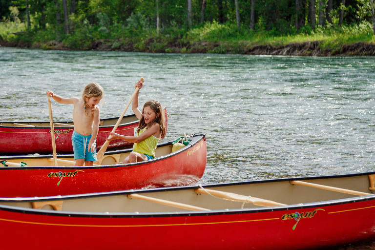 Kids playing in canoe