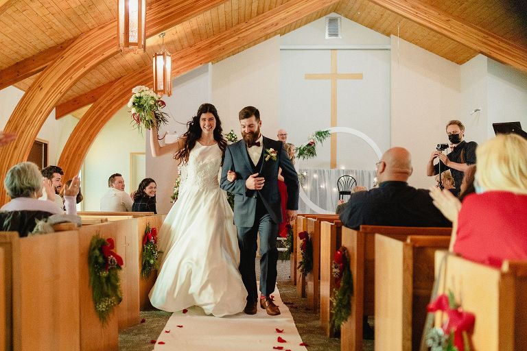 Fernie Wedding Photographer walking down aisle