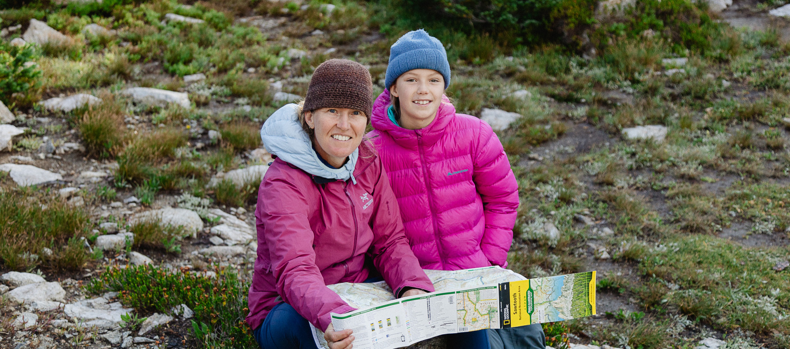 Mother and Daughter in the backcountry reading a trail map